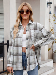Oversized plaid shirt jacket in white with brown plaid, featuring a pocket and button front.
