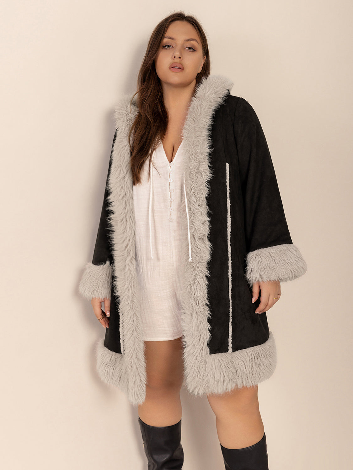 Black hooded duster coat with faux shearling trim and cuffs.