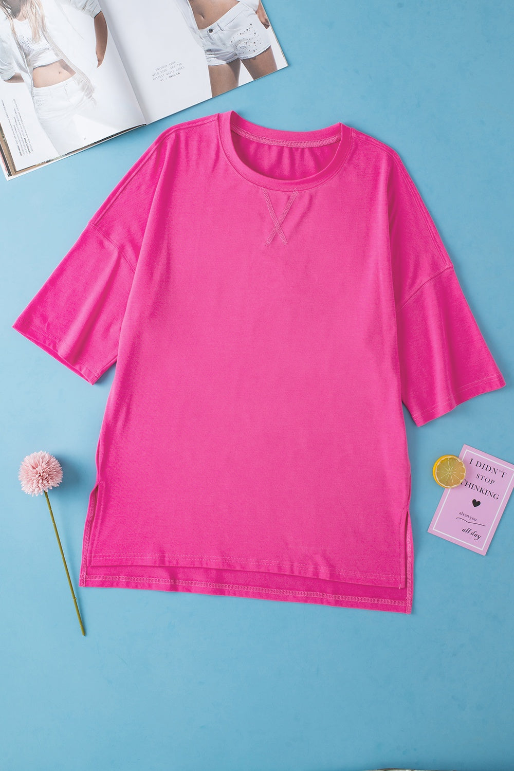 Pink boxy cotton t-shirt with crew neck and shoulder stitch detail.