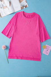 Pink boxy cotton t-shirt with crew neck and shoulder stitch detail.