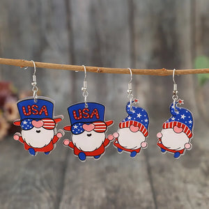 Patriotic gnome drop earrings in royal blue acrylic with USA hats and star patterns.