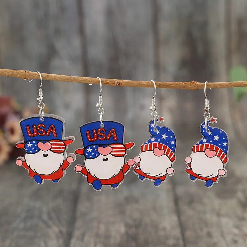 Patriotic gnome drop earrings in royal blue acrylic with USA hats and star patterns.