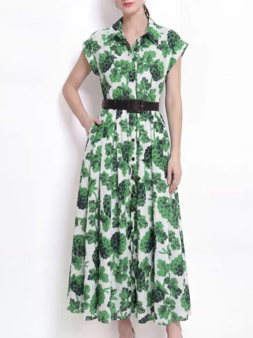 Green botanical print collared midi dress with button-down front and short sleeves.