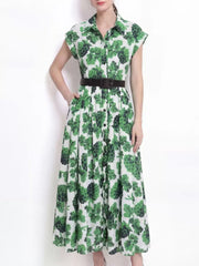 Green botanical print collared midi dress with button-down front and short sleeves.