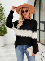 Black and white colorblock ribbed sweater with a crew neck and long sleeves.