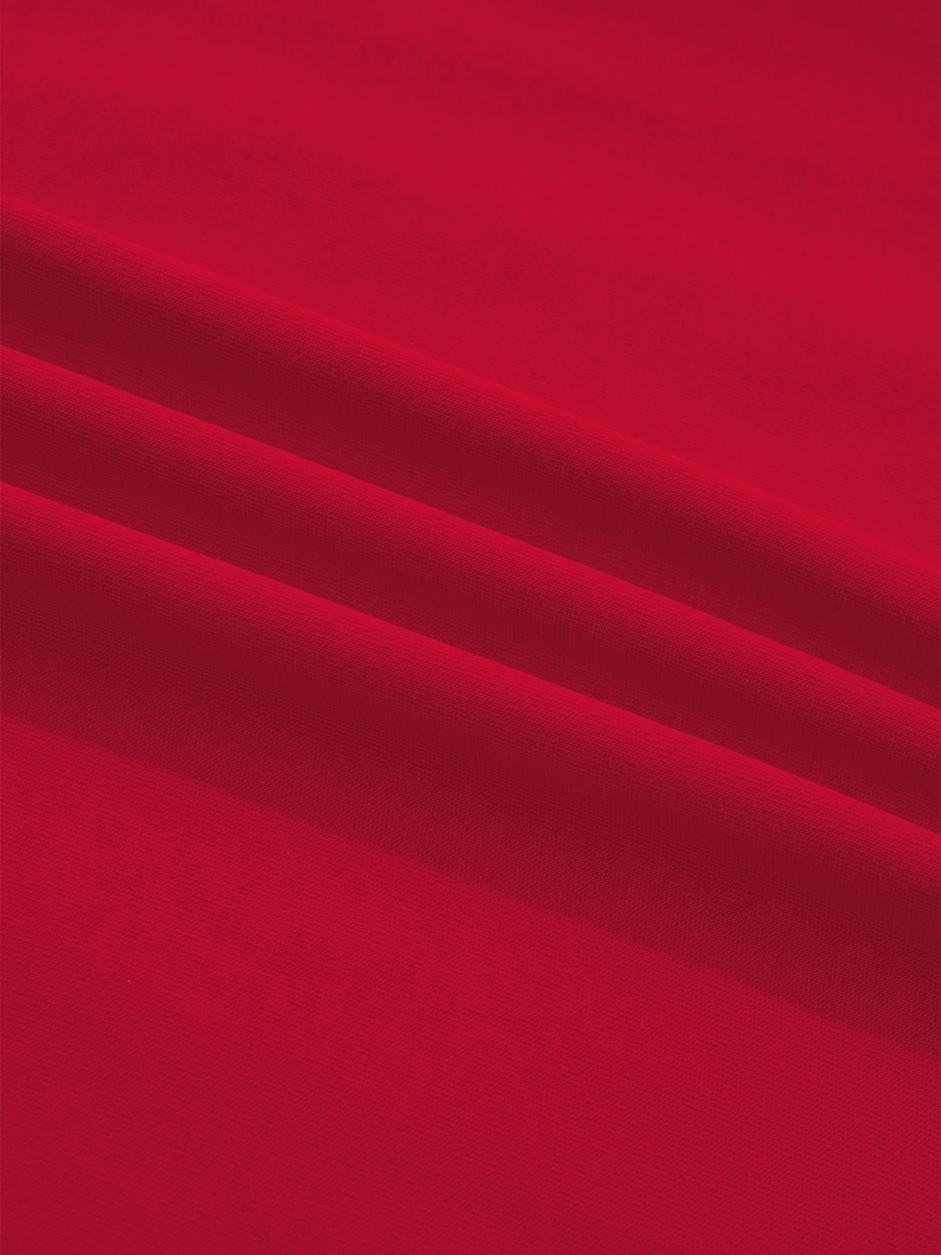 Red cotton blend drop shoulder tee with textured fabric detail