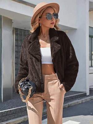 Faux fur biker jacket in chocolate brown with a relaxed fit and lapel collar.