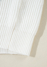 White ribbed knit sweater with subtle heart embellishment detail