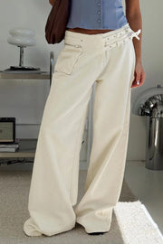 Cream cotton flared jeans with utility pockets and double buckle waist detail