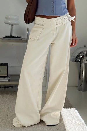 Cream cotton flared jeans with utility pockets and double buckle waist detail