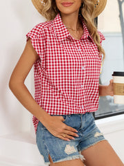 Red gingham cotton shirt with cap sleeves and button-down front.