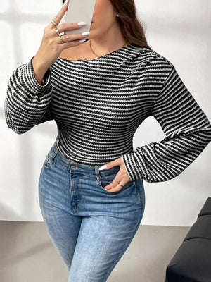 Black and white striped maternity t-shirt with one-shoulder neckline and balloon sleeves.