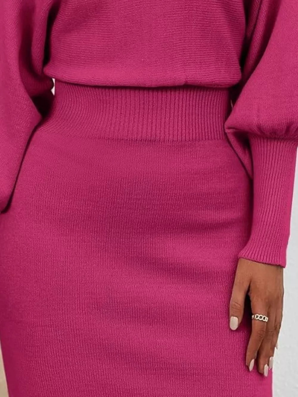 Rose red acrylic bodycon sweater dress with dramatic lantern sleeves and ribbed waist detail.