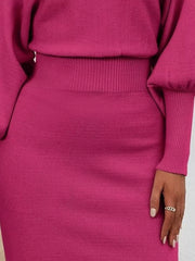 Rose red acrylic bodycon sweater dress with dramatic lantern sleeves and ribbed waist detail.