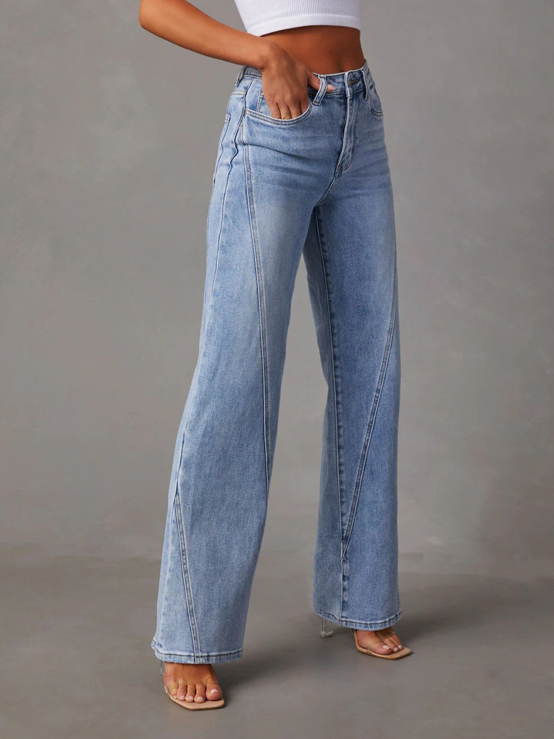 Light wash wide leg jeans with panel seams and a comfortable cotton blend.