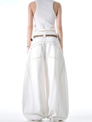White cotton wide-leg jeans with contrast stitching and functional pockets.