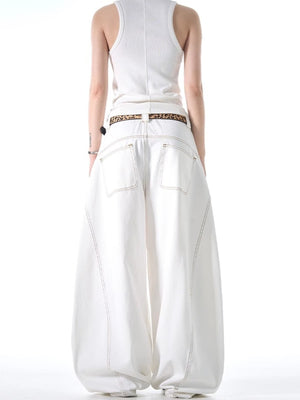 White cotton wide-leg jeans with contrast stitching and functional pockets.