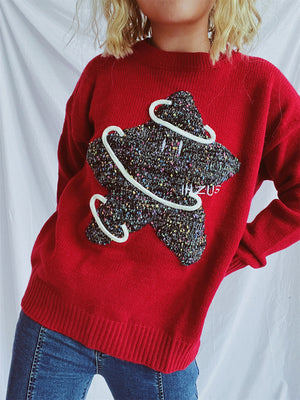 Scarlet knit jumper with embroidered starburst detail and white piping.