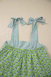 Floral tie-strap tank top with square neckline and green stripe detail.
