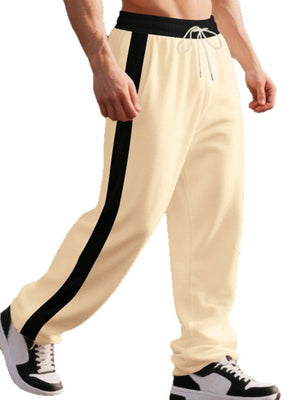 Men's Khaki wide-leg sweatpants with black side stripe and drawstring waist.
