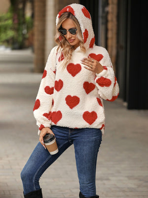 Cream sherpa hoodie with red heart print and hood.