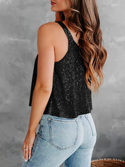 Black sequin tank top with flounce detail and spaghetti straps.