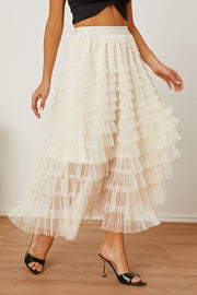 Tiered tulle maxi skirt in ivory with ruffled layers and a flowy silhouette.