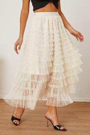 Tiered tulle maxi skirt in ivory with ruffled layers and a flowy silhouette.