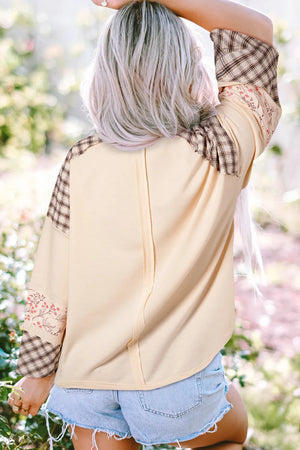 Patchwork heart raglan top in tan with plaid and floral sleeve details.
