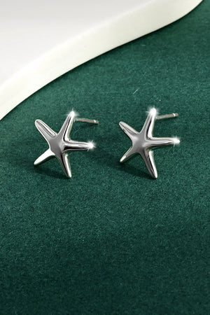 Sculpted silver starfish stud earrings with a polished finish.