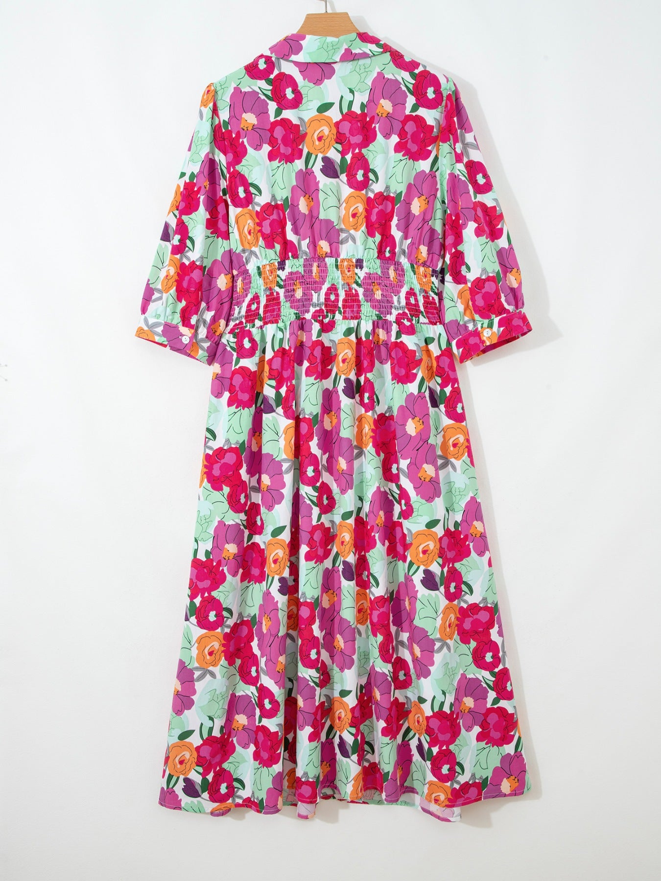 Floral V-neck cotton midi dress with smocked waist and 3/4 sleeves.