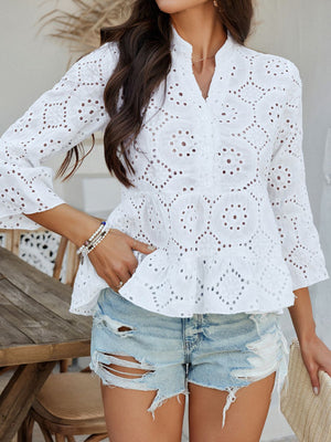 White eyelet embroidered peplum blouse with ruffles and bell sleeves.