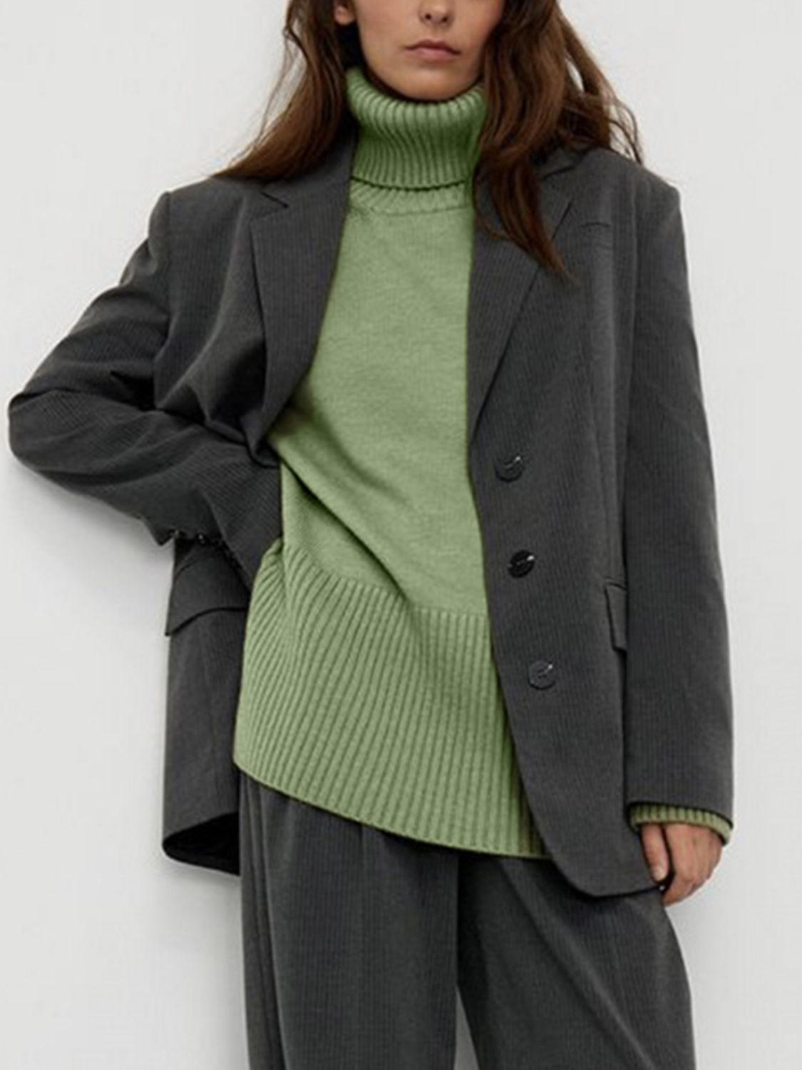 Flared sleeve ribbed turtleneck sweater in Matcha Green, styled with a gray pinstripe blazer.