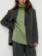 Flared sleeve ribbed turtleneck sweater in Matcha Green, styled with a gray pinstripe blazer.