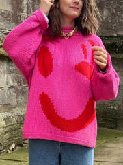 Hot Pink knit sweater with a large red abstract smiley face graphic.