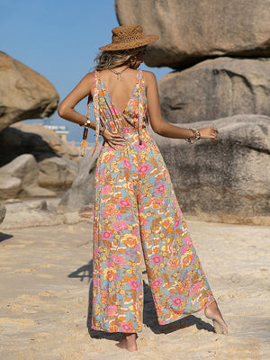 Bohemian floral tie-strap jumpsuit with wide legs and a deep V-neckline.