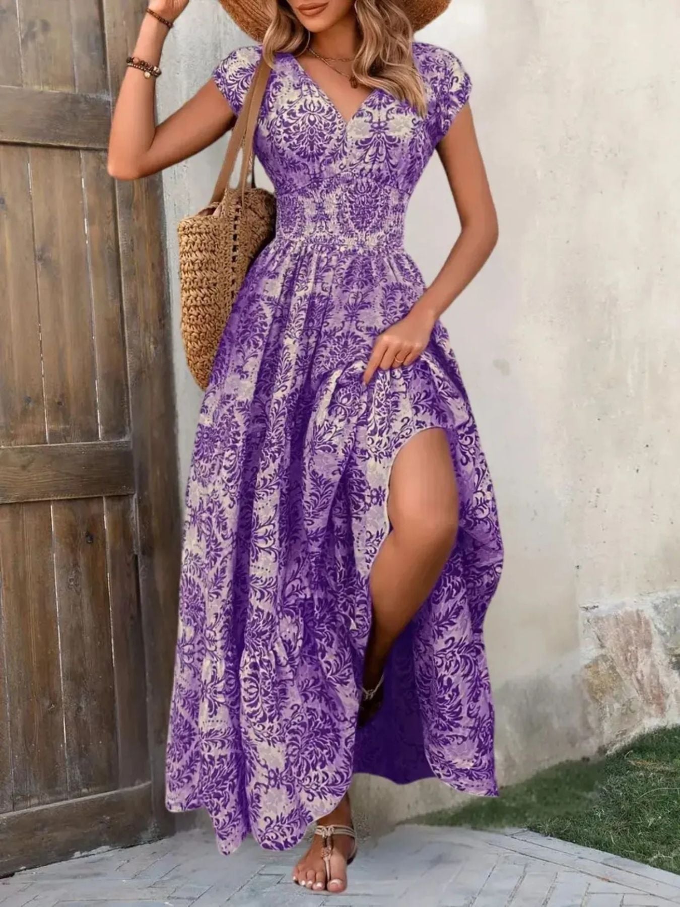 Purple damask print maxi dress with cap sleeves and a high slit.