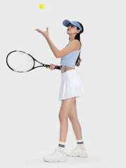White pleated performance mini skirt with a tennis player holding a racket.