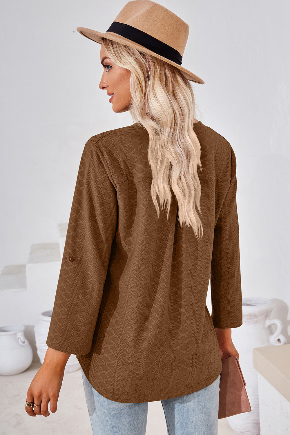 Textured henley shirt in mocha with roll-tab sleeves and a curved hem.