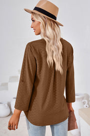 Textured henley shirt in mocha with roll-tab sleeves and a curved hem.