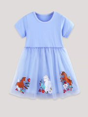 Light blue tulle dress with horse and flower embroidery, short sleeves, round neck.