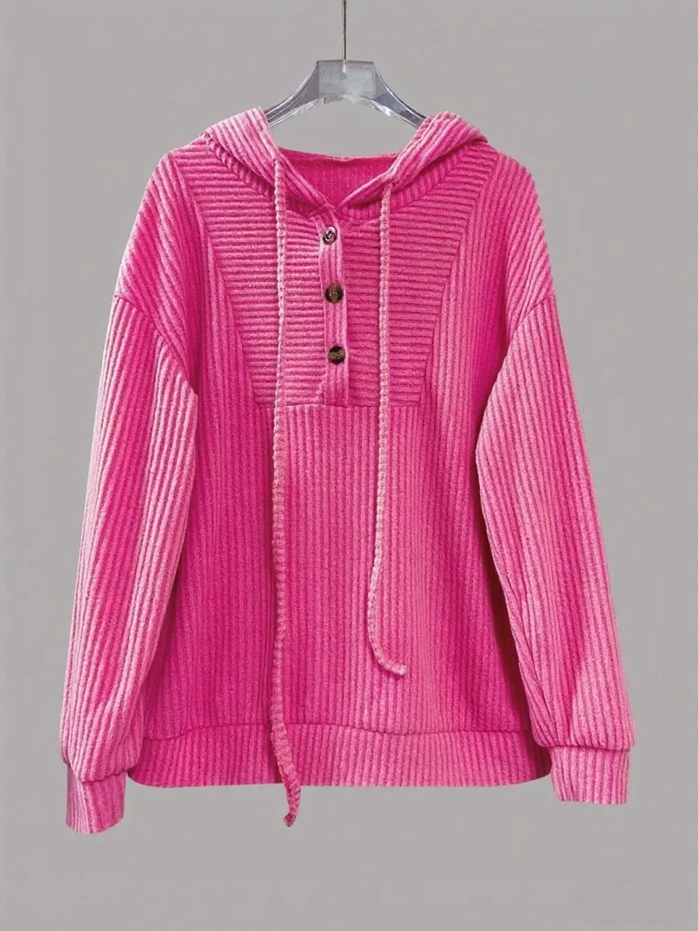 Fuchsia pink corduroy button-front hoodie with drawstring and ribbed details.
