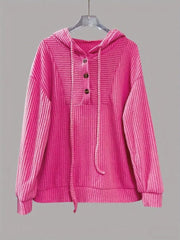Fuchsia pink corduroy button-front hoodie with drawstring and ribbed details.