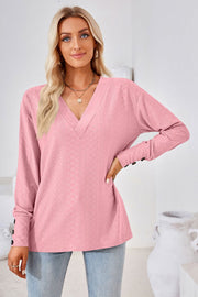 Textured blush pink V-neck blouse with button cuff detail