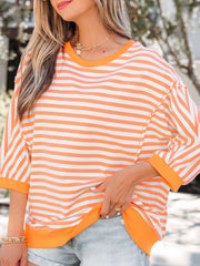 Oversized orange and white striped cotton t-shirt with 3/4 sleeves and crew neck.