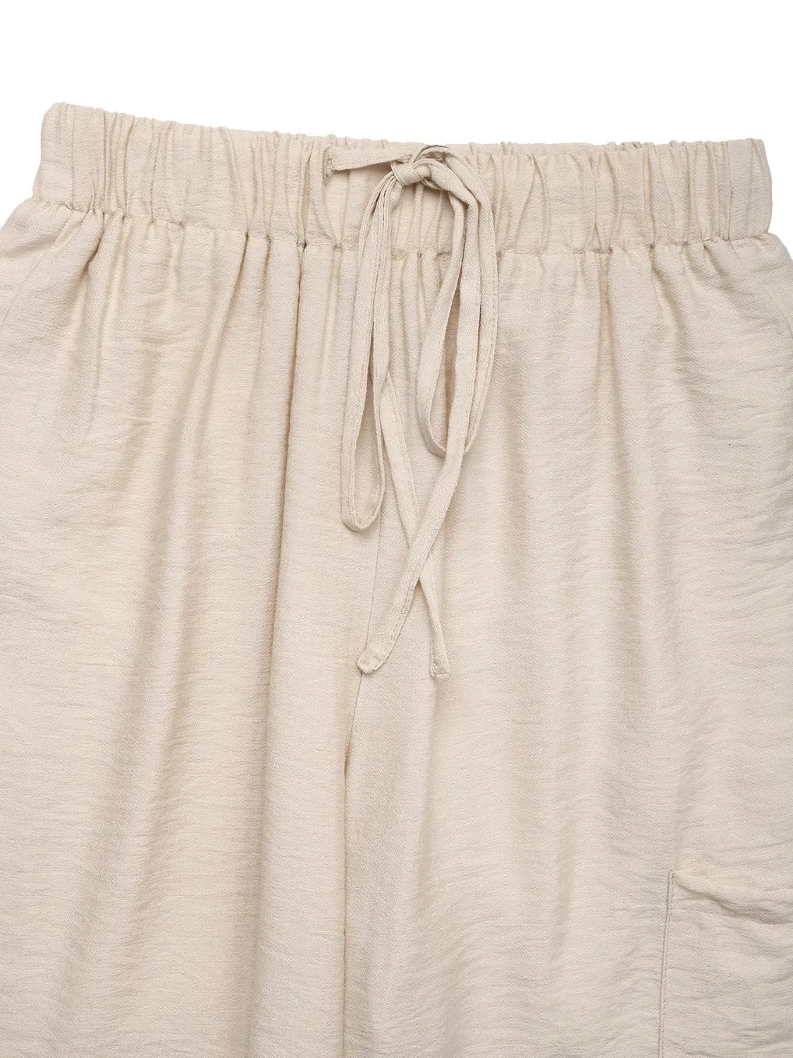 Chic waist-tie flare trousers in tan with a drawstring waist and textured fabric.