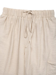 Chic waist-tie flare trousers in tan with a drawstring waist and textured fabric.