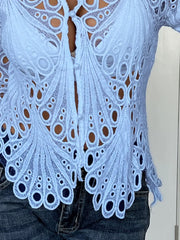 Blue lace button-up blouse with scalloped collar and intricate peacock feather pattern.