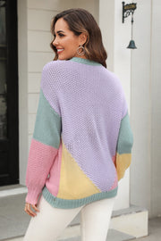 Colorblock knit sweater with sculpted sleeves in pastel lavender, mint green, pink, and yellow acrylic.