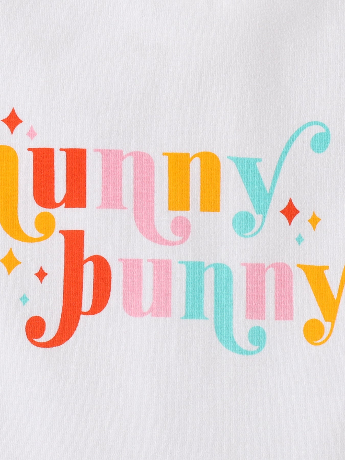 White baby set with colorful "hunny bunny" graphic and sparkle details.